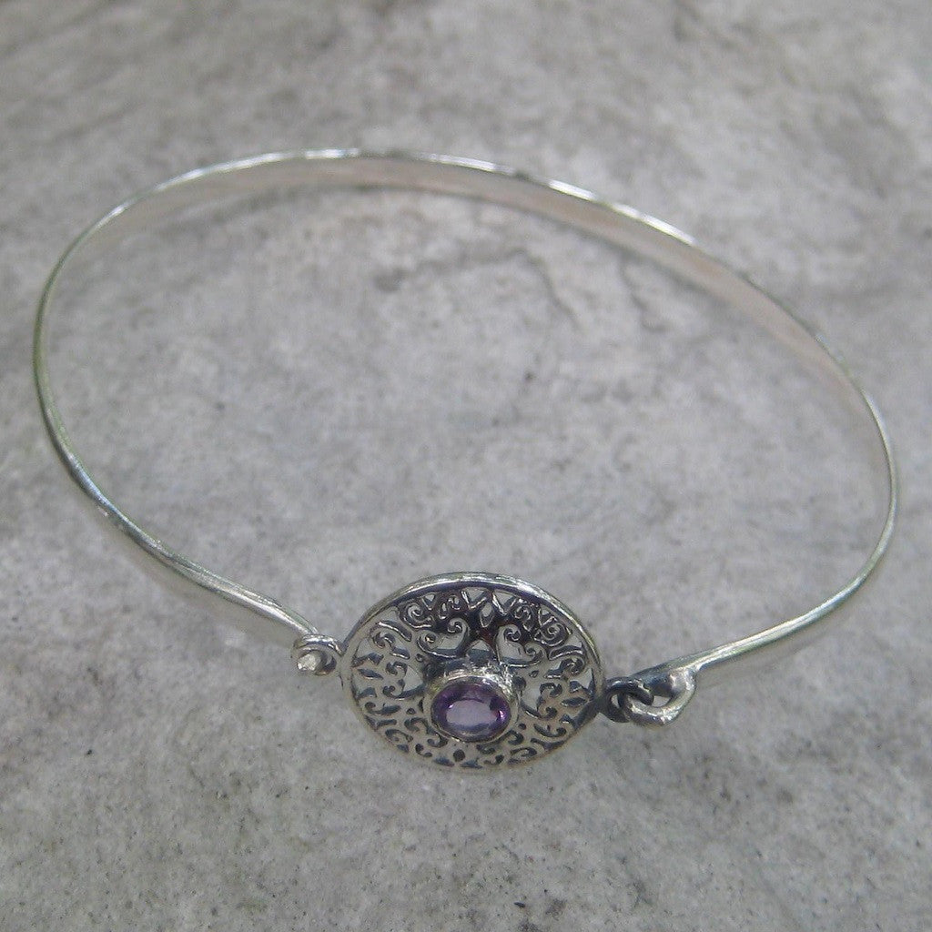 Sterling Silver Amethyst Celtic Bracelet  features an amethyst gemstone at the center of the Celtic heart knot design face