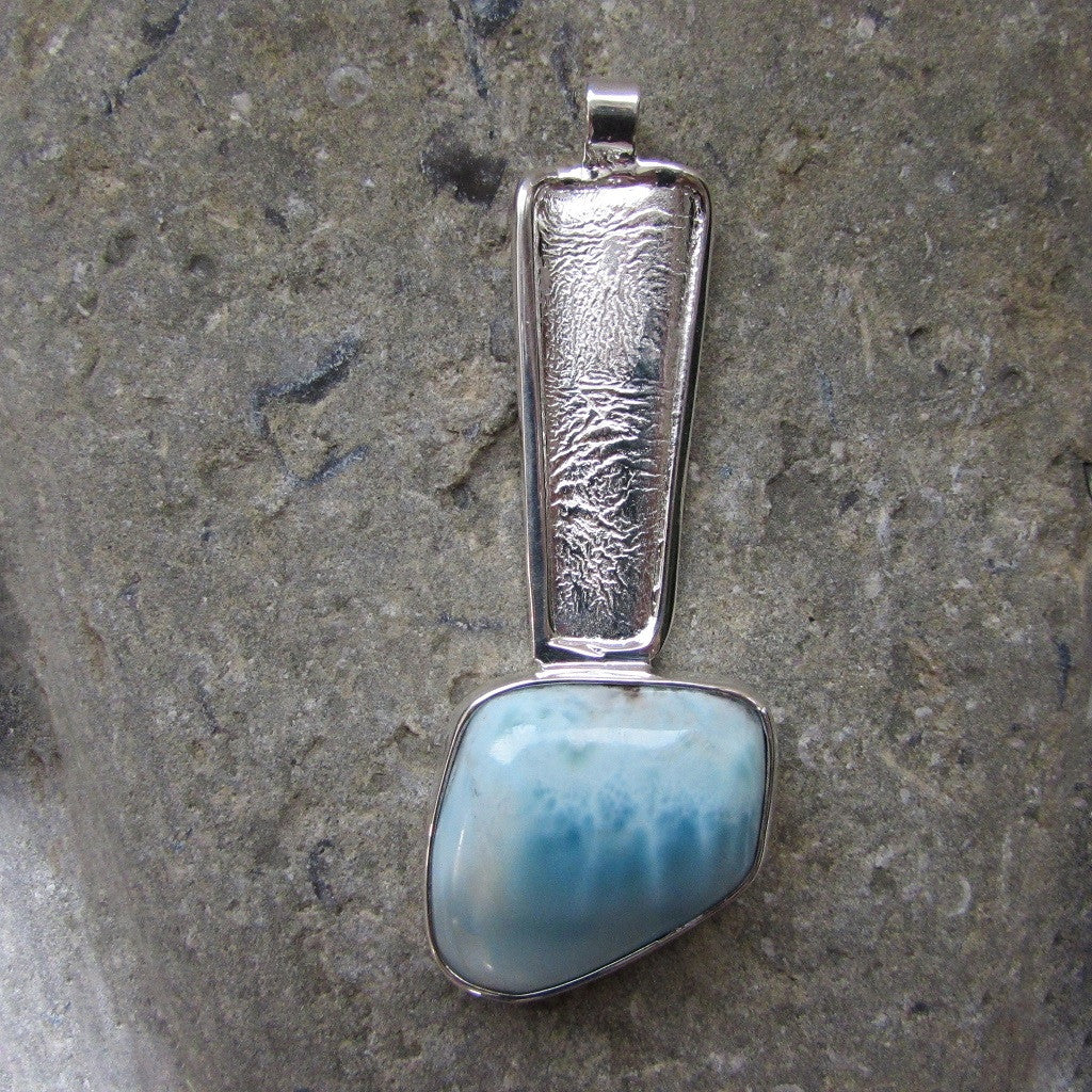 Sterling Silver Larimar Stone Long Pendant  features an irregular shaped Larimar gemstone set in a textured sterling silver bar