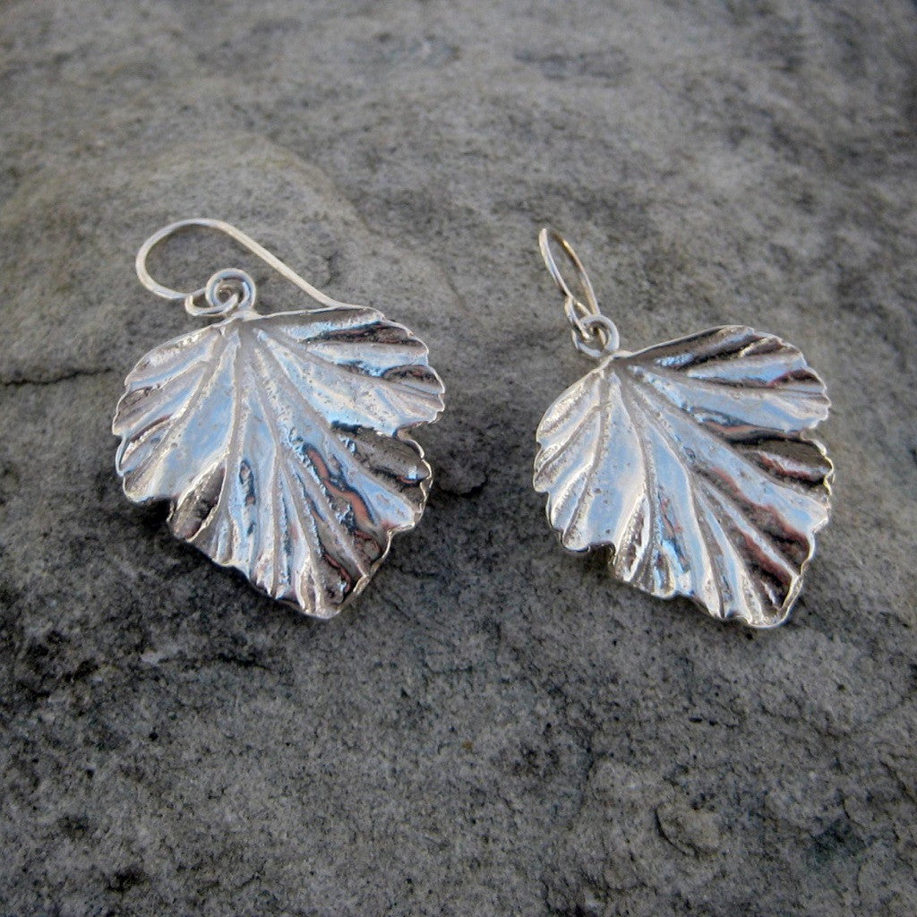 Sterling Silver Leaf Drop Earrings crafted in Sterling Silver feature a Raspberry Latte Tree Leaf Motif finished with a french wire