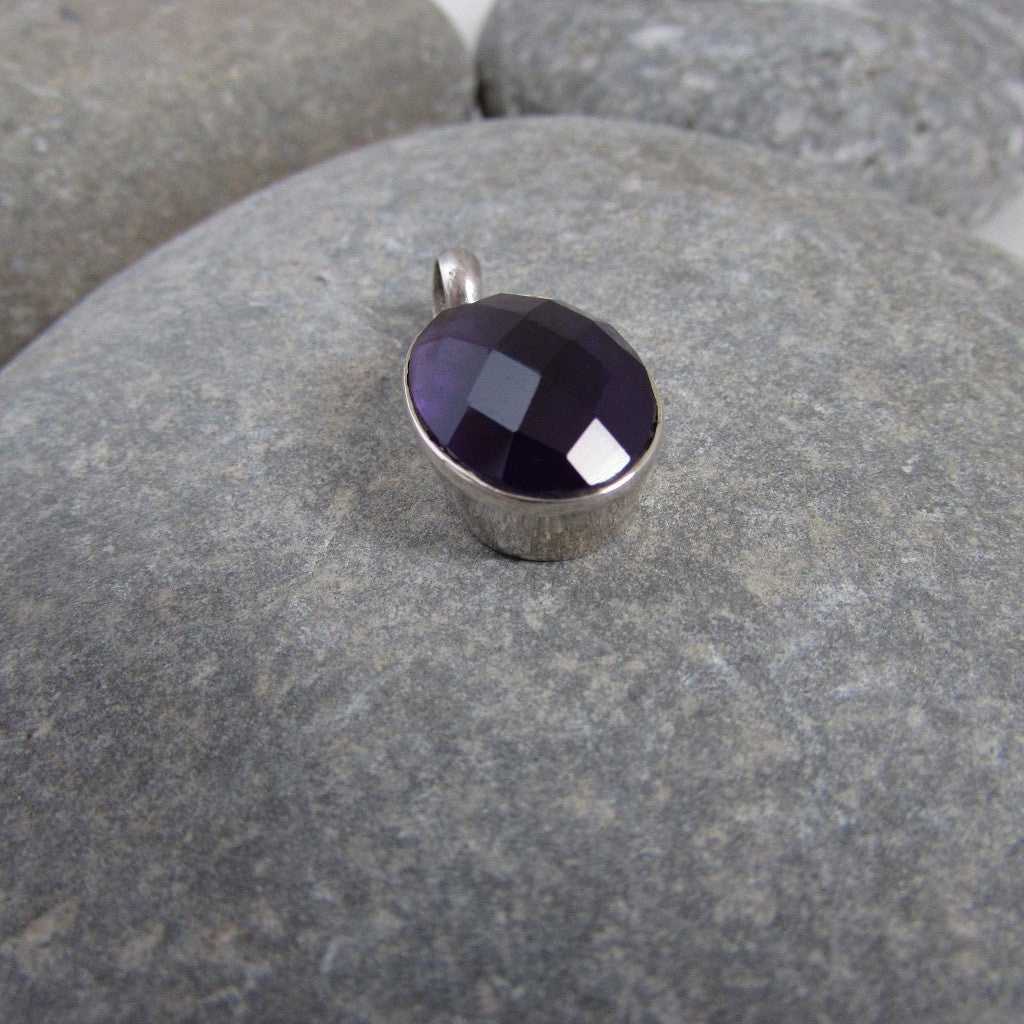  features a generous size dome shape, faceted amethyst gemstone side view shows the generous size of the pendant